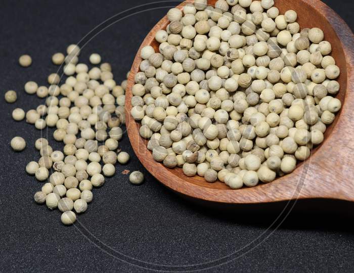 White Pepper seeds isolated on black background
