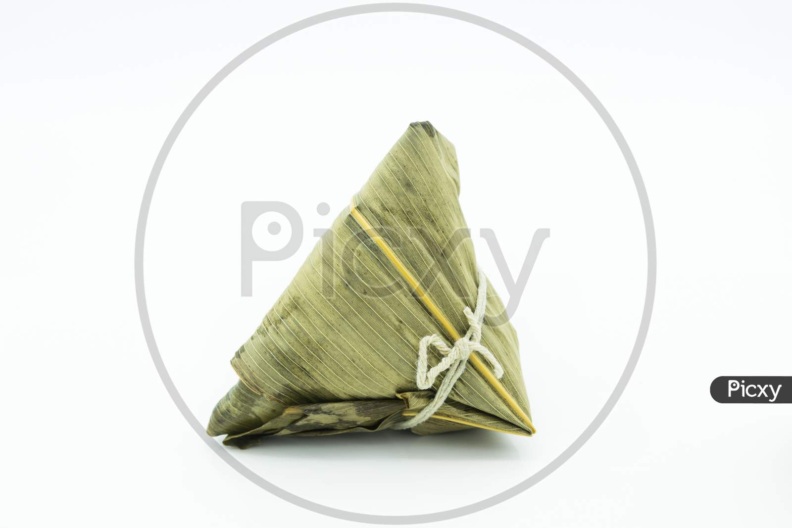 Closeup View Of The Zongzi (Sticky Rice Dumplings), It Is A Traditional Chinese Rice Dish Made Of Glutinous Rice Stuffed With Different Fillings And Wrapped In Reed Leaves.