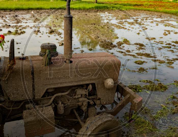 Mahindra tractor in Indian fields. Tractor in agricultural fields.