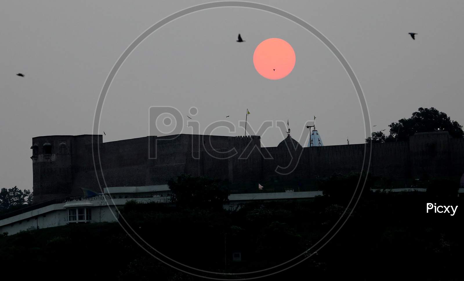 A view of Kali Mata Temple in the backdrop of a sunrise, during ongoing COVID-19 Unlock 2.0, in Jammu on July 27, 2020