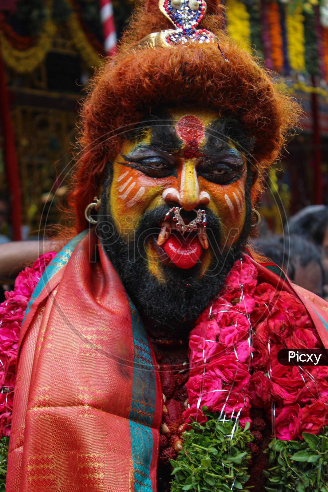 potrait of Pothuraju performing in bonalu festival