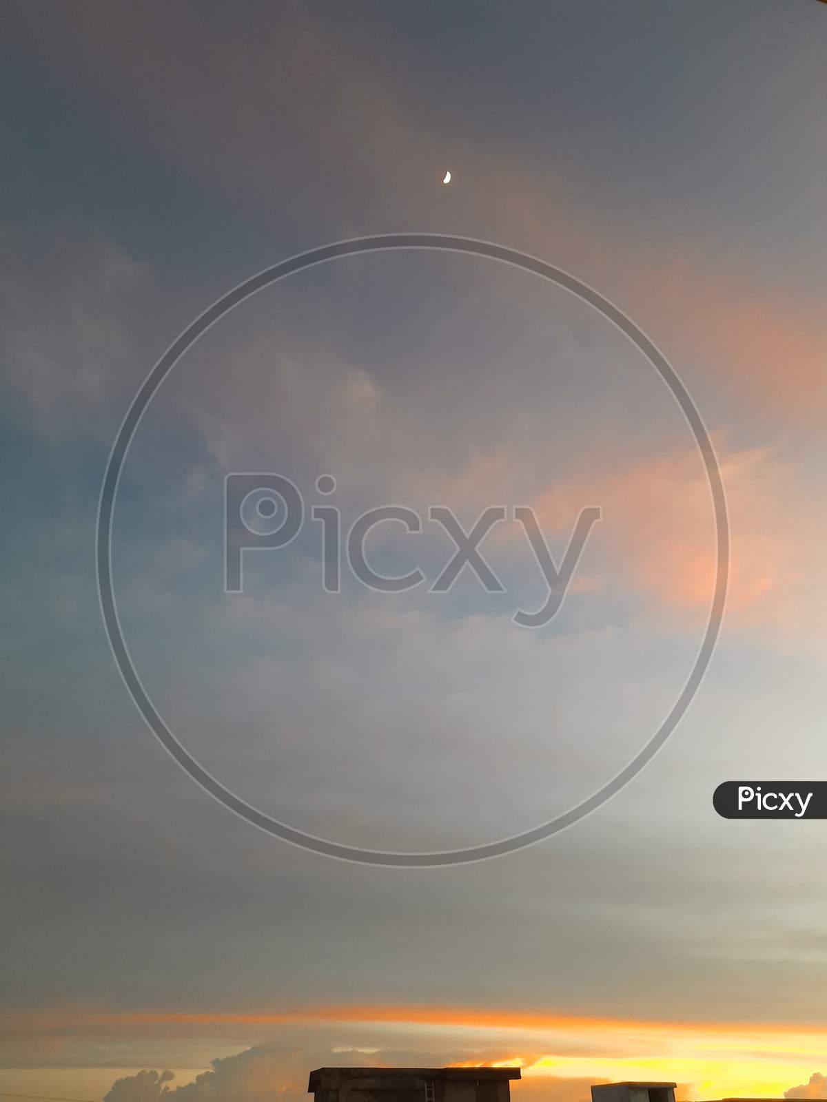 Sunset sky with moon in the frame