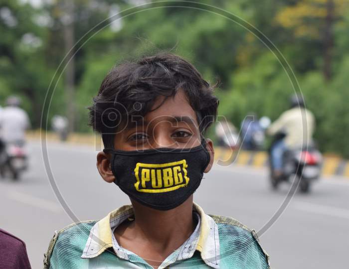 Hyderabad, Telangana, India. July-22-2020: Wearing A Mask, A Boy Standing At Road Side While Wearing Face Mask, Corona Pandemic Time