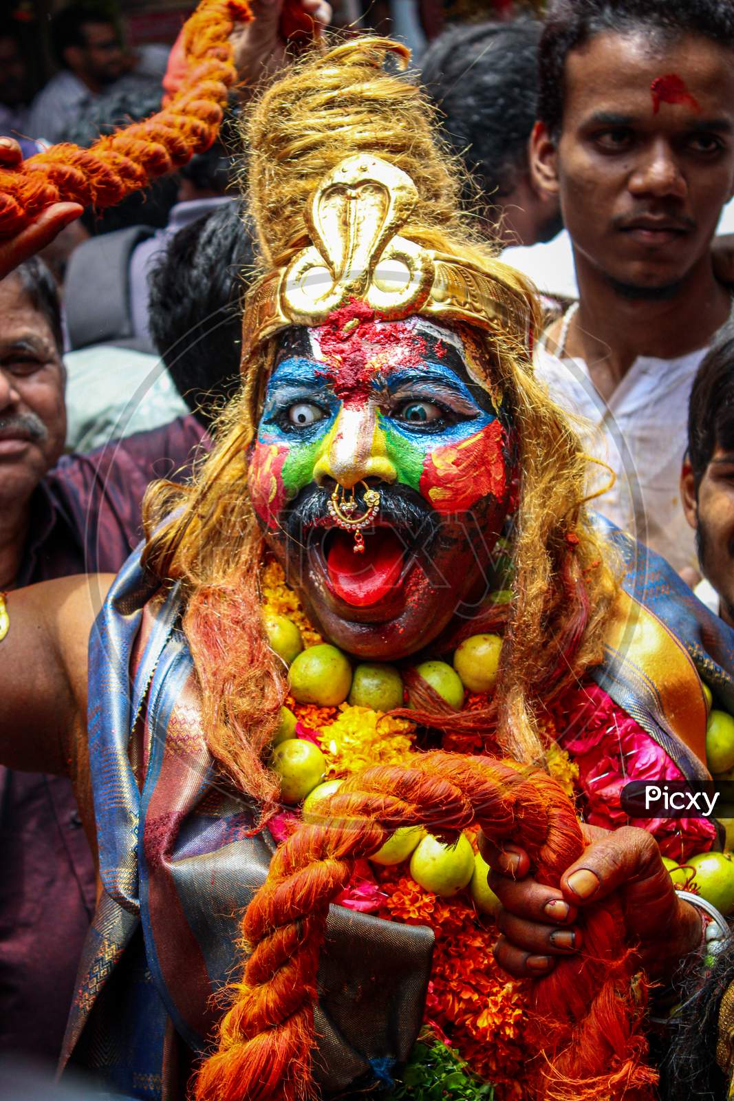 potrait of Pothuraju performing in bonalu festival