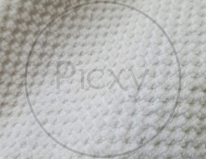 A grey fabric with textured pattern