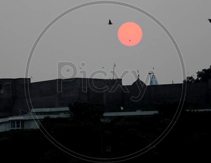 A view of Kali Mata Temple in the backdrop of a sunrise, during ongoing COVID-19 Unlock 2.0, in Jammu on July 27, 2020