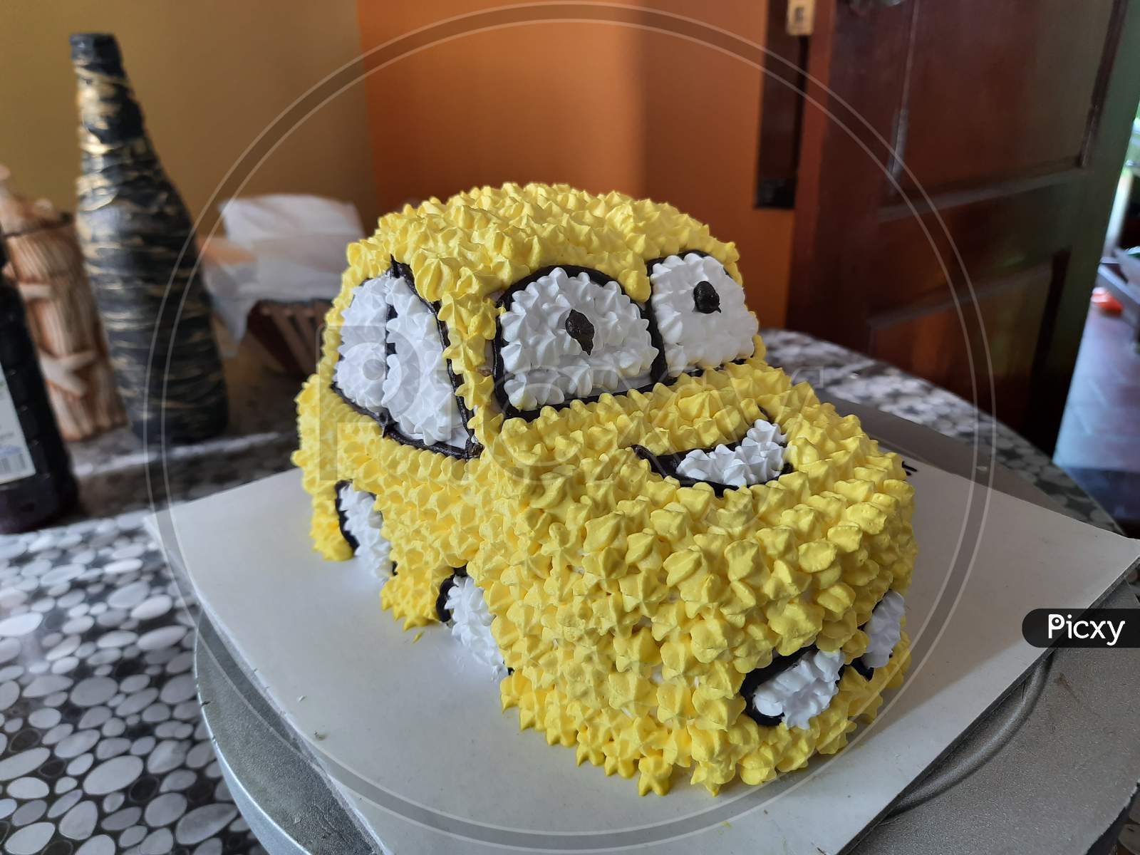 Yellow colour car designed cake