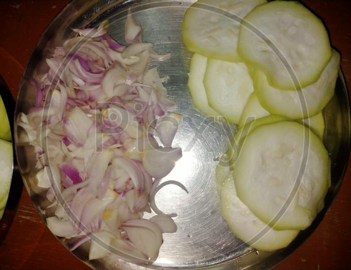 Cutting vegetable to cook food.