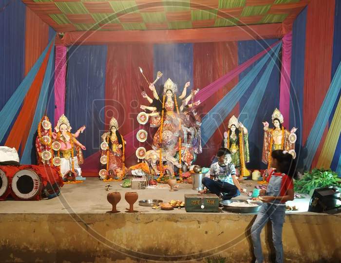 celebrating Durga Pooja at a pandal during navratras