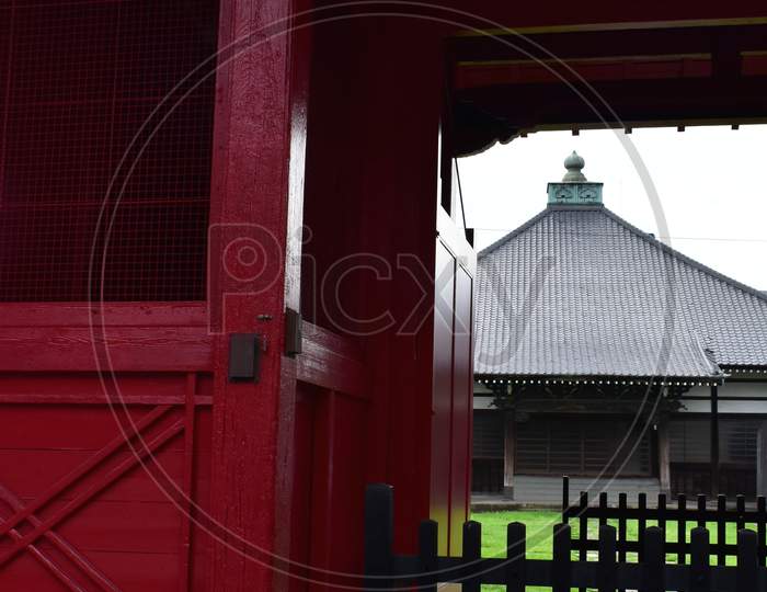 Through the historical gate of the temple Sengaku in Tokyo Japan