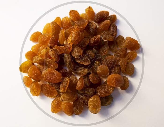 Top Shot Of Dry Fruit Raisins Seedless Kishmish On White Background