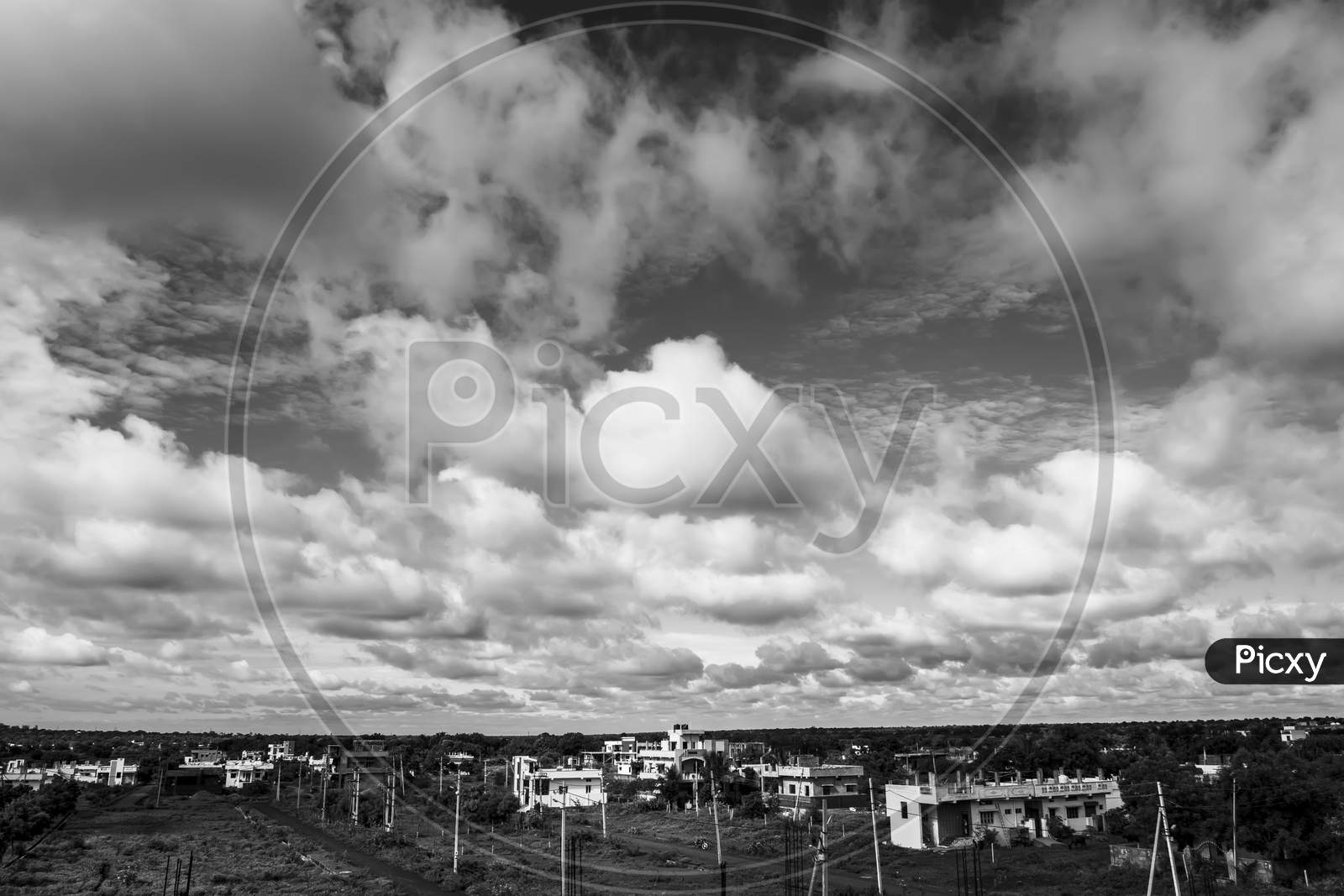 Black & White Shot Of City scape With Sky, Clouds & Land