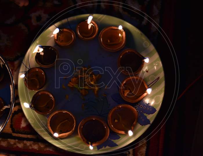 Diwali Diyas And Flowers In Plate
