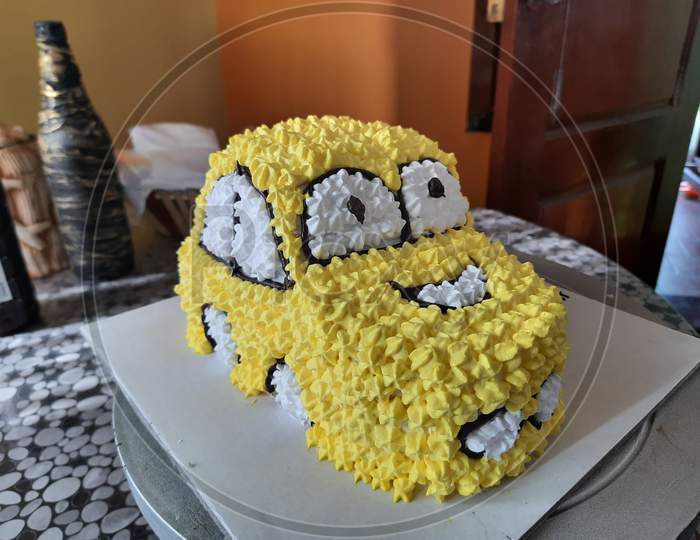Yellow colour car designed cake