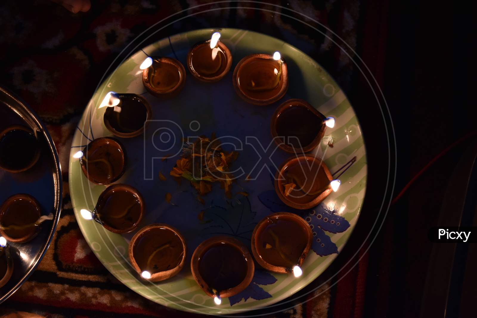 Diwali Diyas And Flowers In Plate