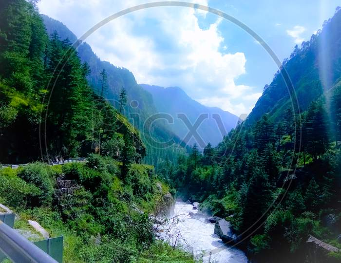 Mesmerizing kasol valley with Parbati river flowing deep through the valley in Kullu Himachal Pradesh.