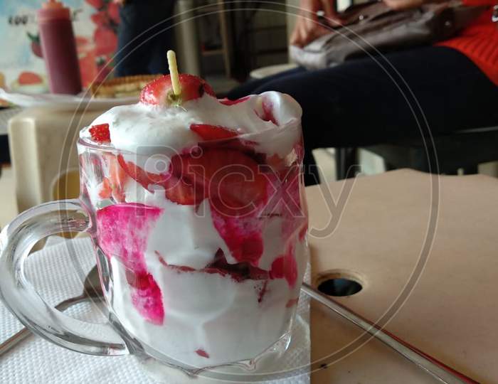 Vanilla ice cream with whipped strawberry cream