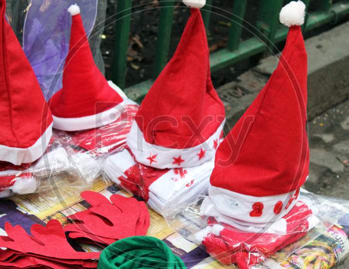 Colorful Christmas wearable hats selling for fun and enjoyment on a open shop at Dharmatala, Kolkata.