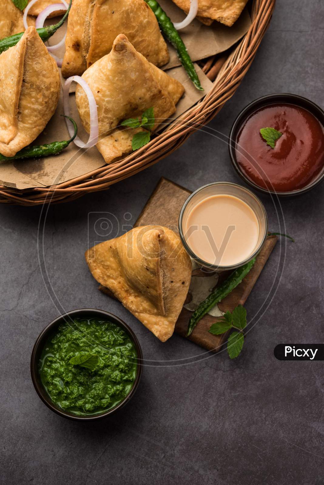 Samosa Snack Is An Indian Deep Fried Pastry With A Spiced Filling Usually Made With Potatoes, Spices And Herb