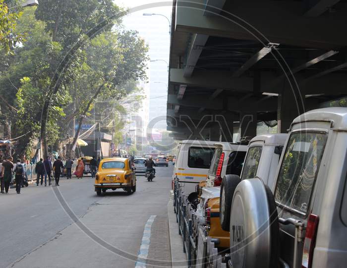 High road and road side parking partial view, at Park street, Kolkata.