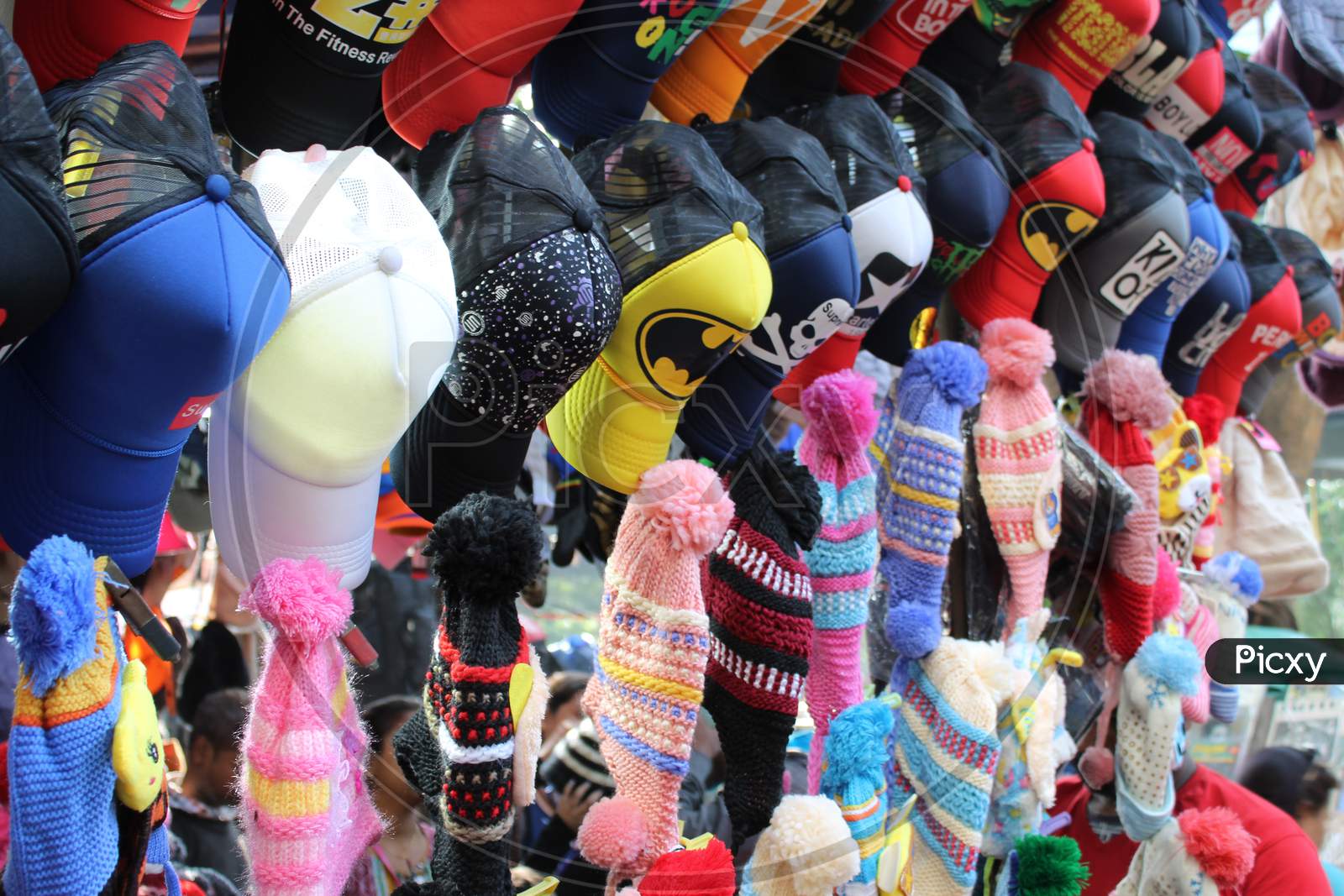 Variety of colorful caps and hats are selling on a open shop, at Esplanade, Kolkata.
