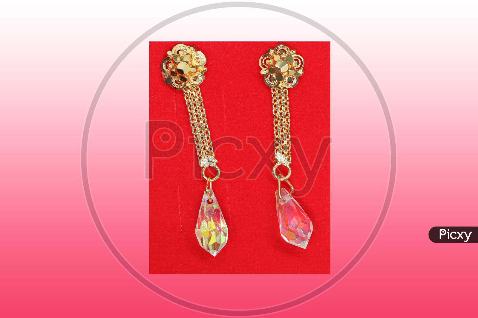 A Pair Of Gold Earrings In Demand