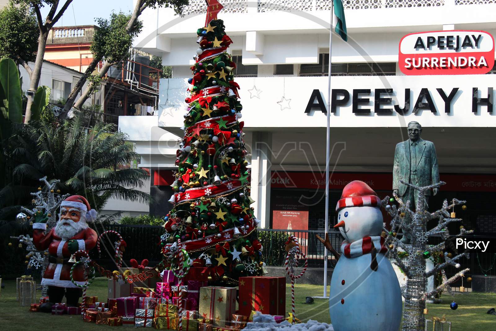 Cropped View of Santa Claus and Christmas tree and colorful gift boxes for Christmas decoration at Park Street,  Kolkata.