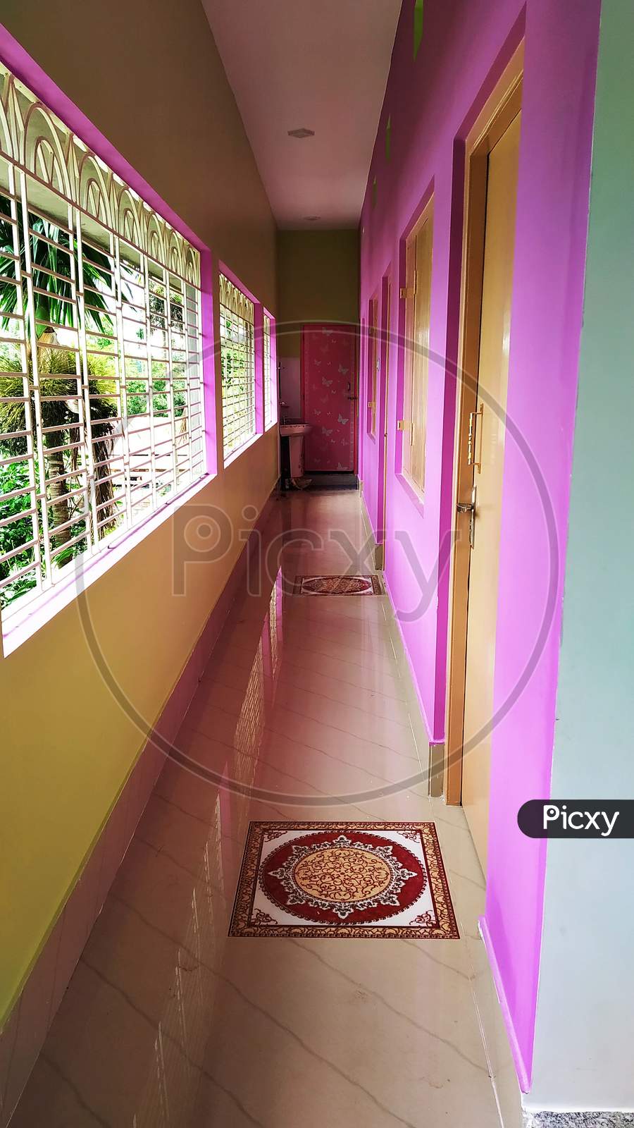 An Interior Of A House With A Long Corridor