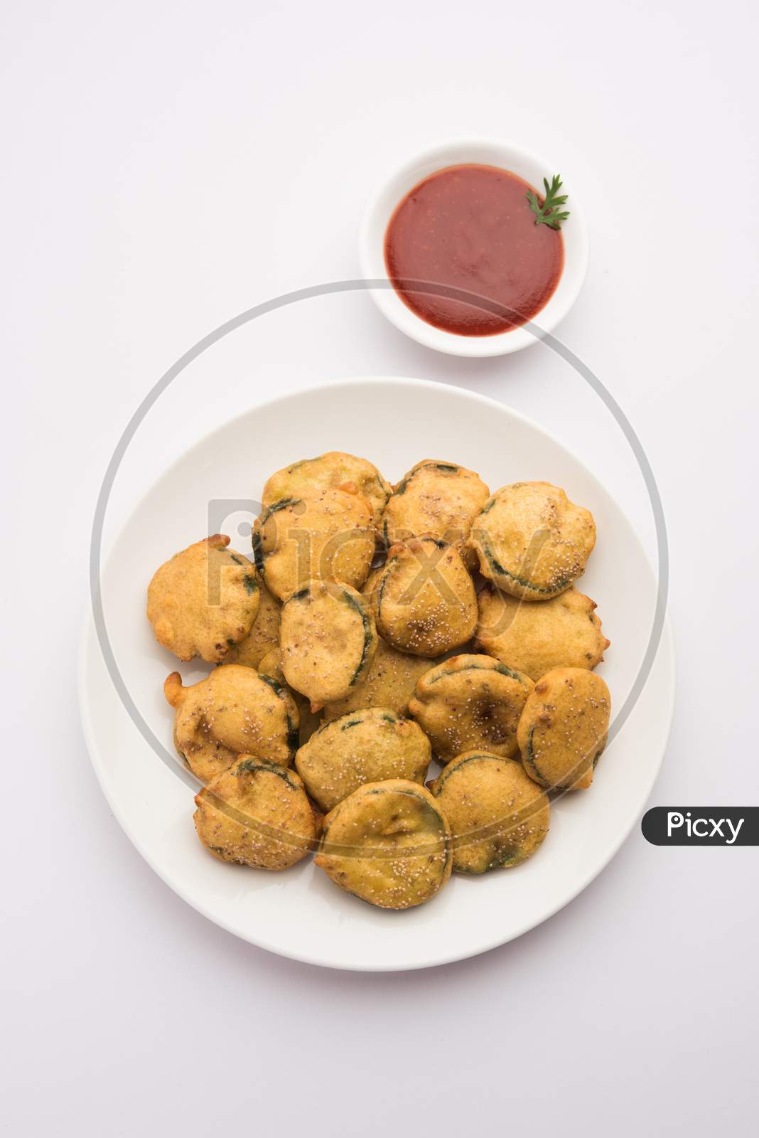 Gilki Pakora /Pakoda / Bhajji Also Known As Sponge Gourd Fritters, Served With Tomato Ketchup