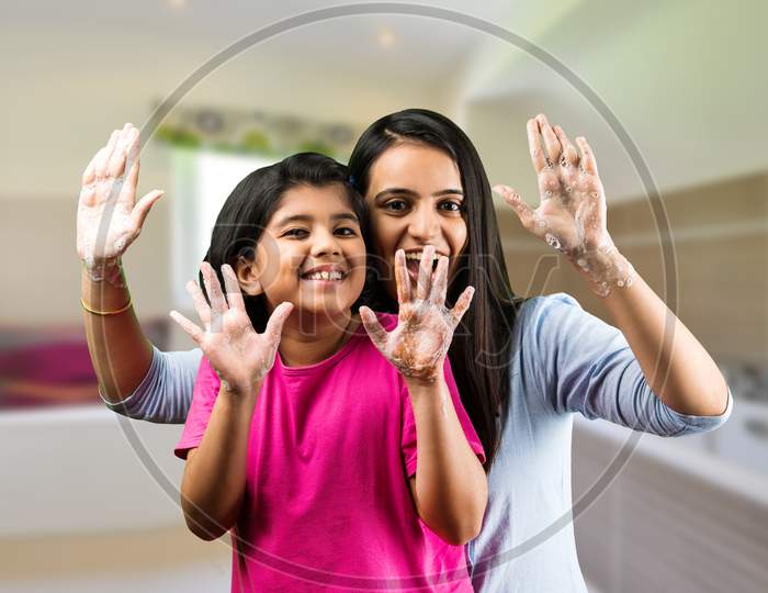 Indian Mother And Daughter Togather Washing Hands With Soap