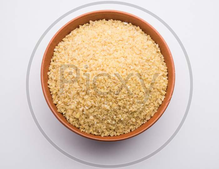 Bulgur, Dalia Or Daliya Or Broken Wheat Is A Raw Cereal Food From India, Served In A Bowl Or Spoon