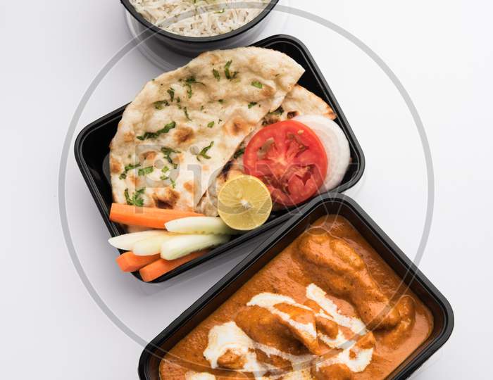 Order Food Online Concept - Murg Makhani Or Butter Chicken Packed In Plastic Container