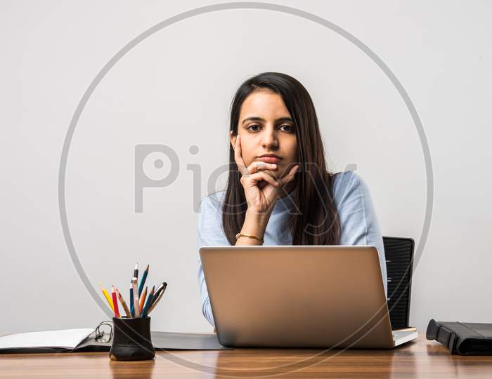 Indian Asian Pretty Girl Working On Laptop At Desk