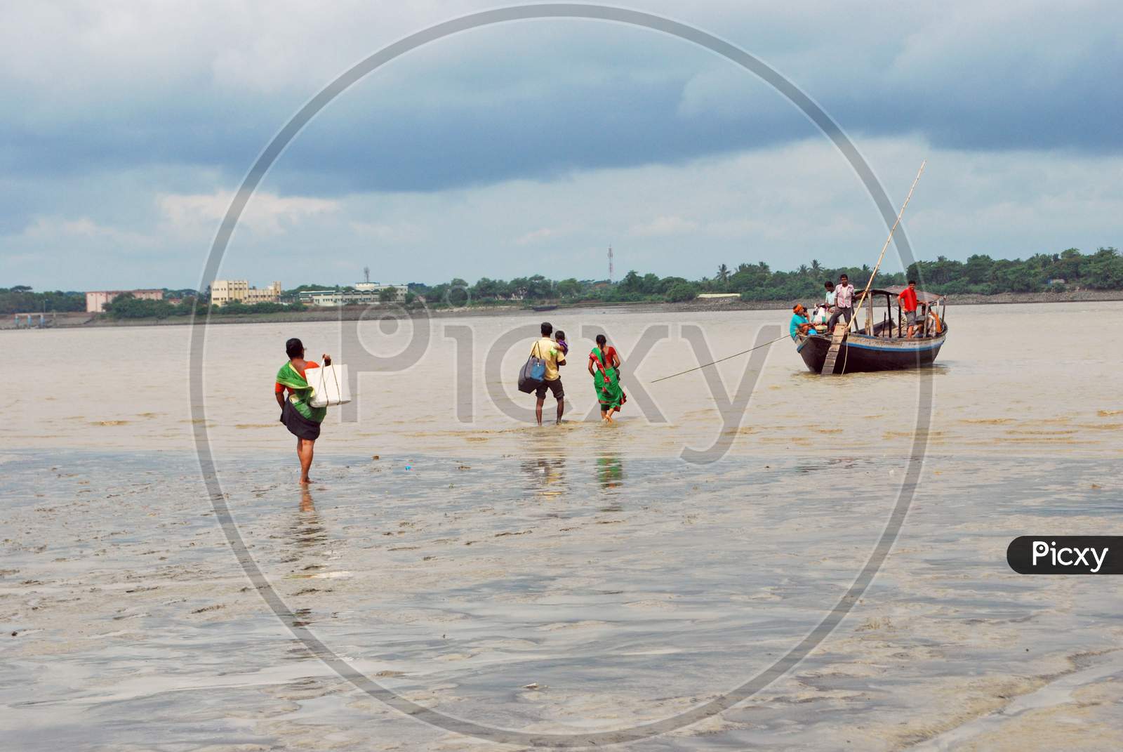 ferry service at rural west bengal during low tide