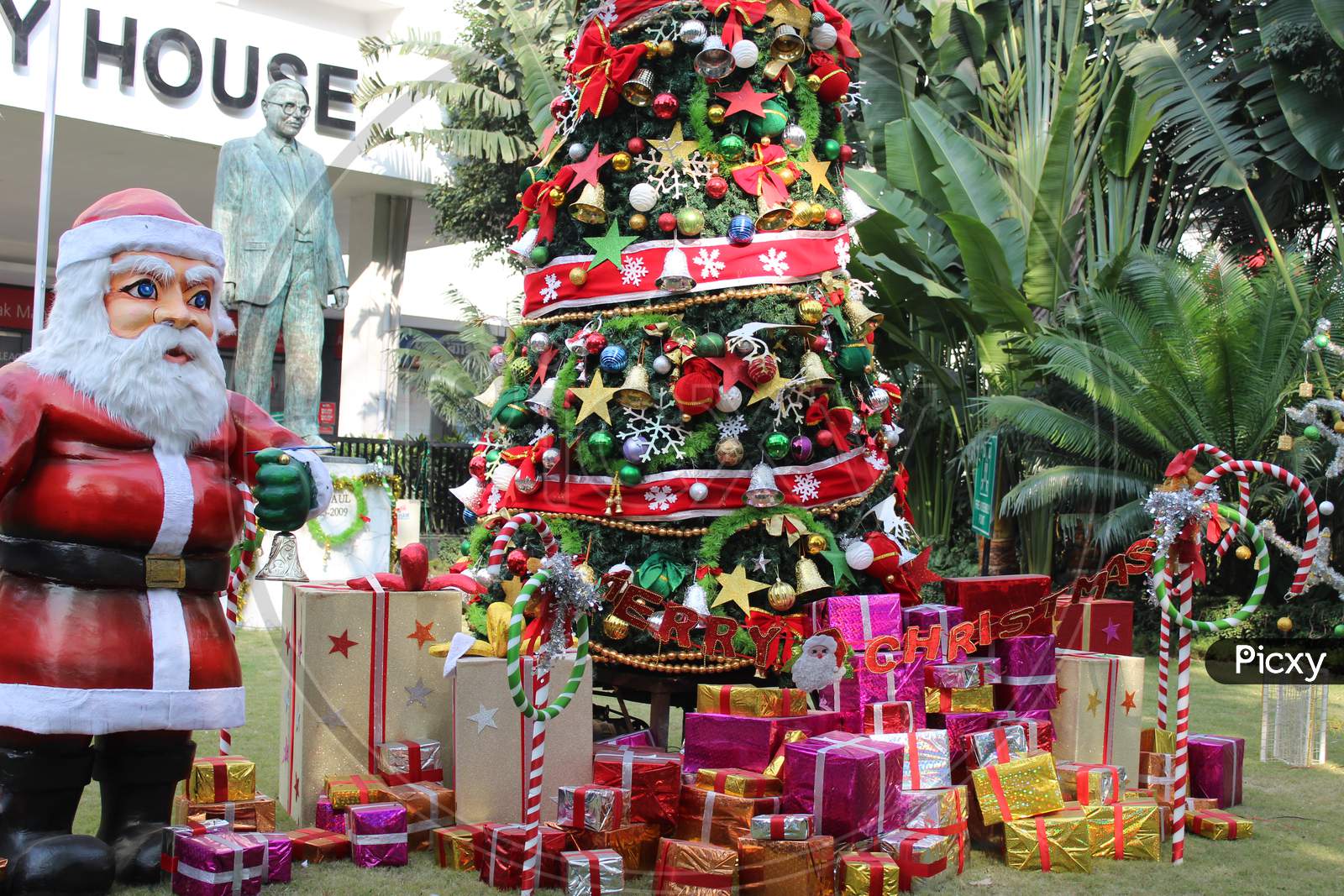 Cropped View of Santa Claus and Christmas tree and colorful gift boxes for Christmas decoration at Park Street,  Kolkata.