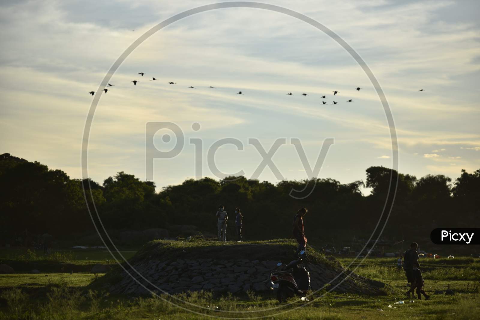People spend their evenings with families at Ameenpur Lake in Hyderabad amid rising concerns of Coronavirus on July 26, 2020.