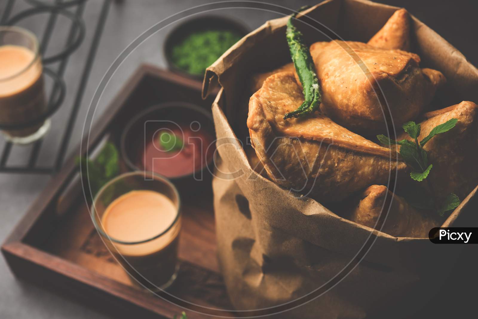 Samosa Snack Is An Indian Deep Fried Pastry With A Spiced Filling Usually Made With Potatoes, Spices And Herb