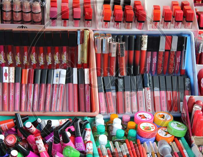 Variety of ladies cosmetics selling on a open shop at a busy market, at Esplanade, Kolkata.