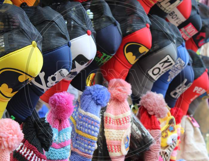 Variety of colorful caps and hats are selling on a open shop, at Esplanade, Kolkata.
