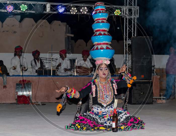 India female artist performing Kalbelia folk dance