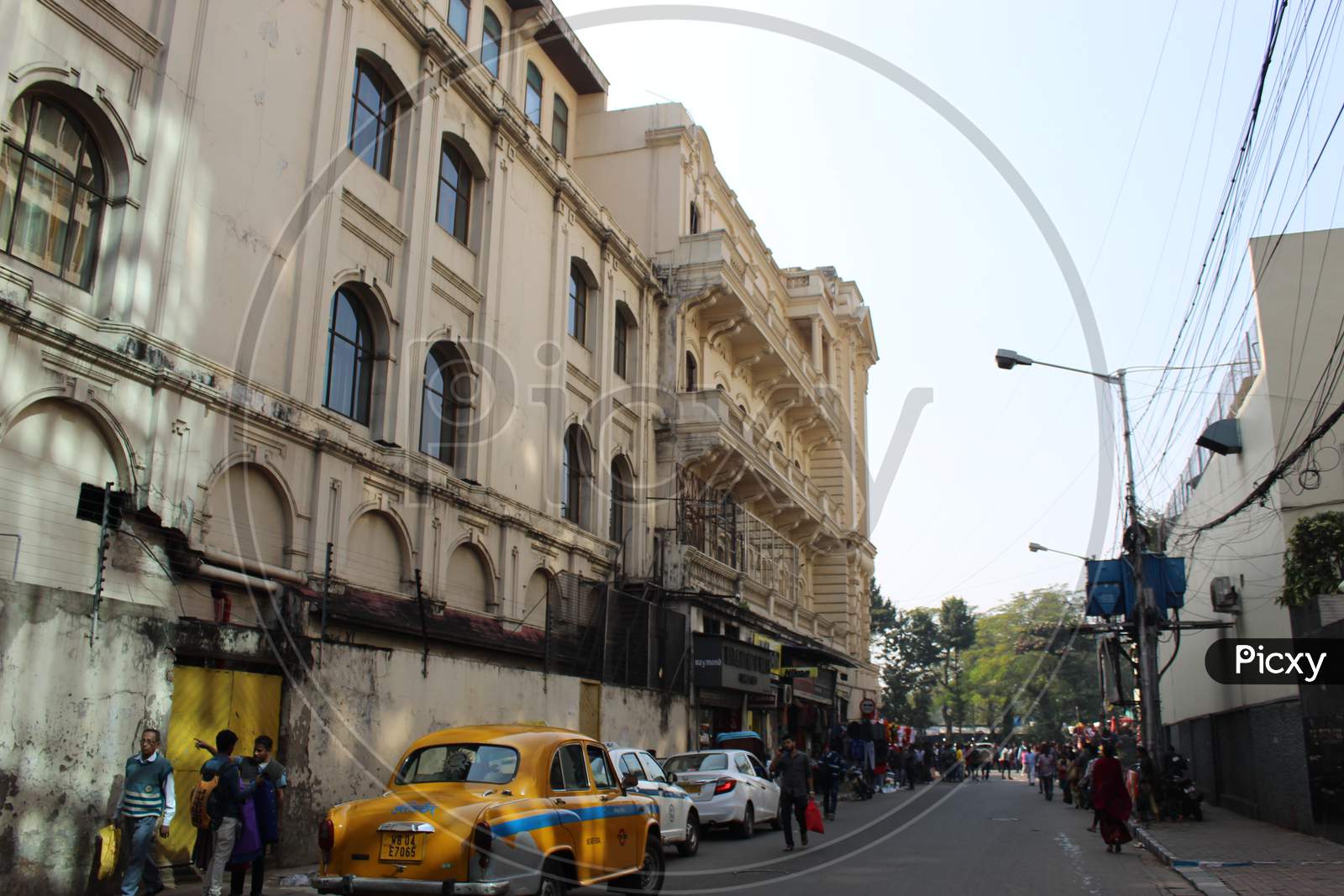 Cropped and partial view of famous `The Oberoi Grand` hotel and busy street, at Esplanade, Dharmatala, Kolkata.
