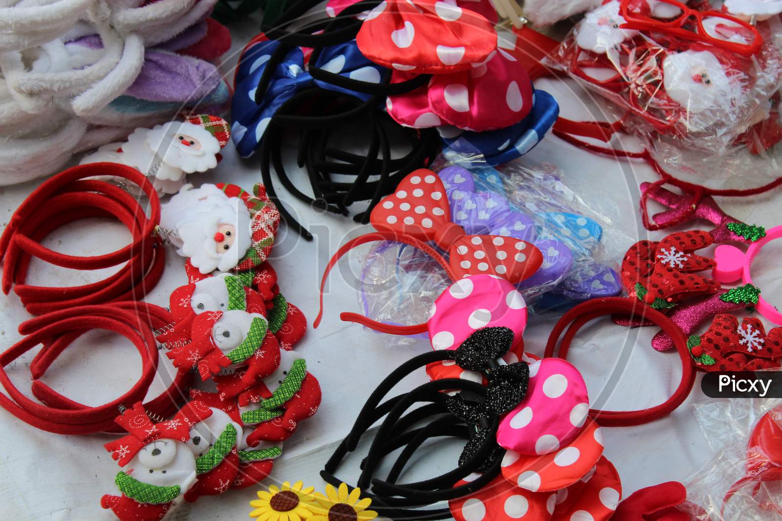Colorful Christmas wearable, fancy hair bands and ribbons selling for fun and enjoyment on a open shop at Dharmatala, Kolkata.