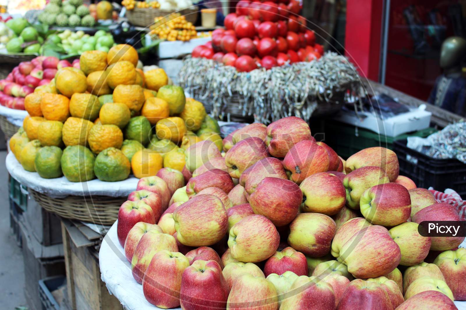 Fruits selling on a open shop at a busy market.