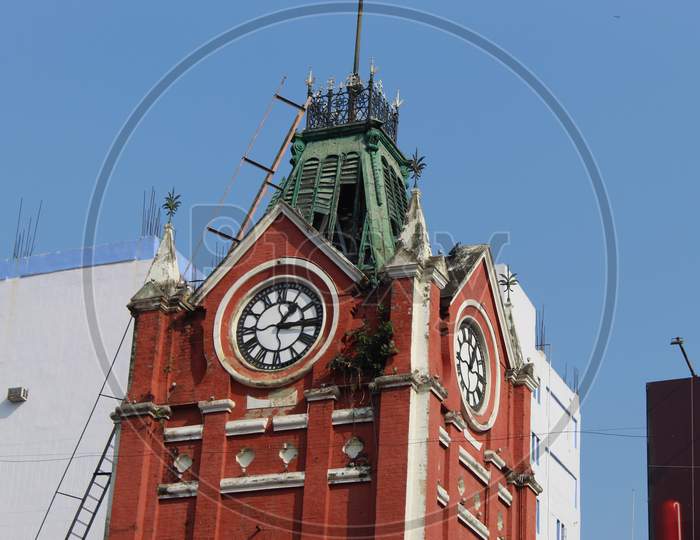 Cropped and partial view of famous 'S.S. Hog Market' clock tower, at Esplanade East, Kolkata, West Bengal 700069.