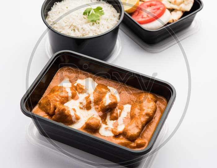 Order Food Online Concept - Murg Makhani Or Butter Chicken Packed In Plastic Container