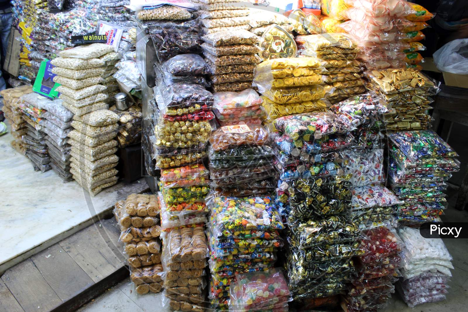 Various Chocolates and sweet Toffees and Candies selling in bulk at a open shop at Dharmatala, Kolkata.