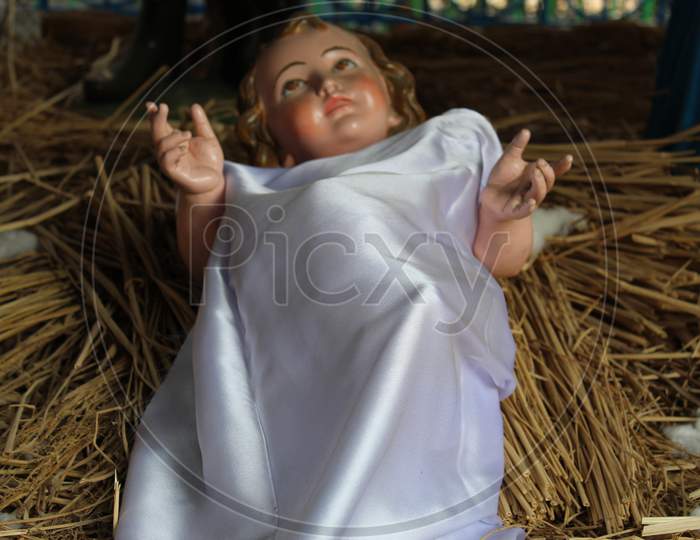 A model of the Nativity scene at Jesus birth in a stable in Bethlehem. Dummy human model statue with selective focus.