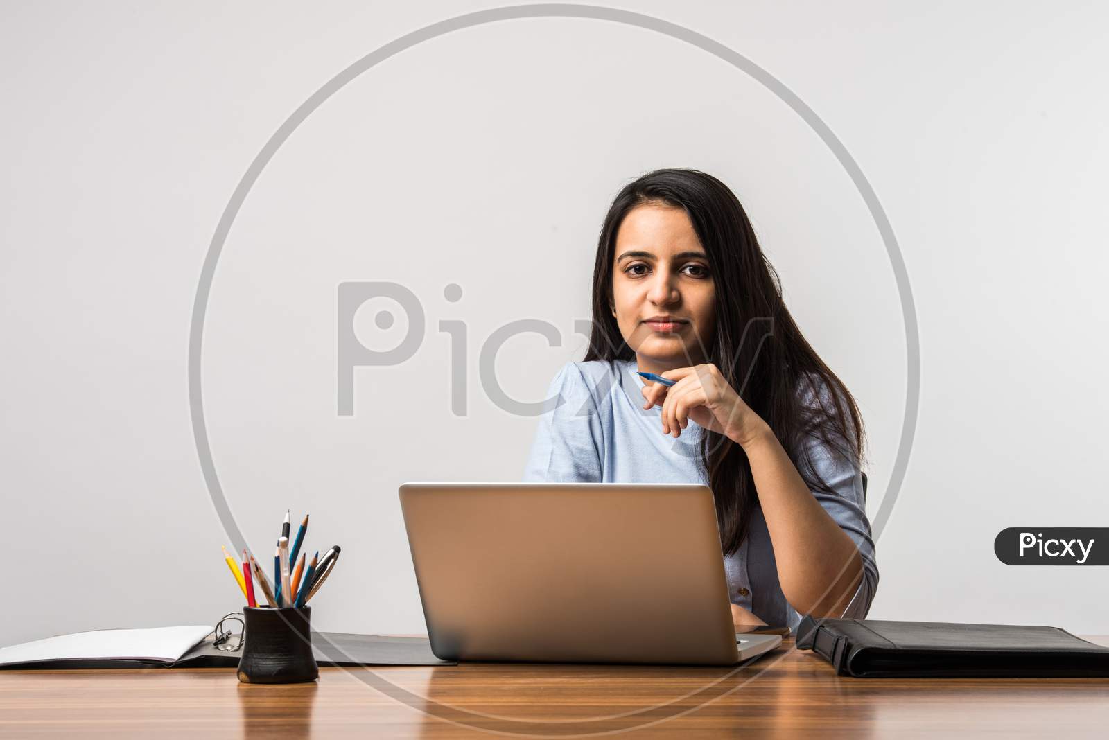 Indian Asian Pretty Girl Working On Laptop At Desk
