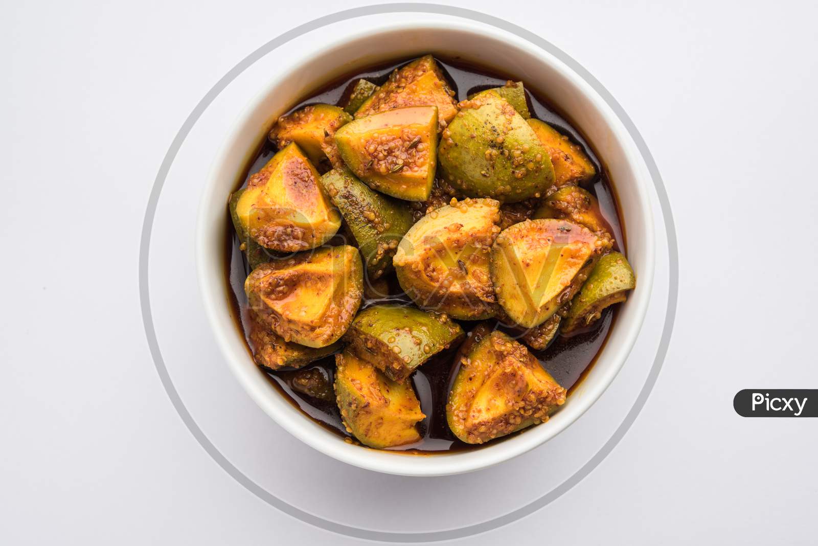 Indian Homemade Raw Mango Pickle Or Aam Ka Achar Or Kairi Loncha In A Bowl