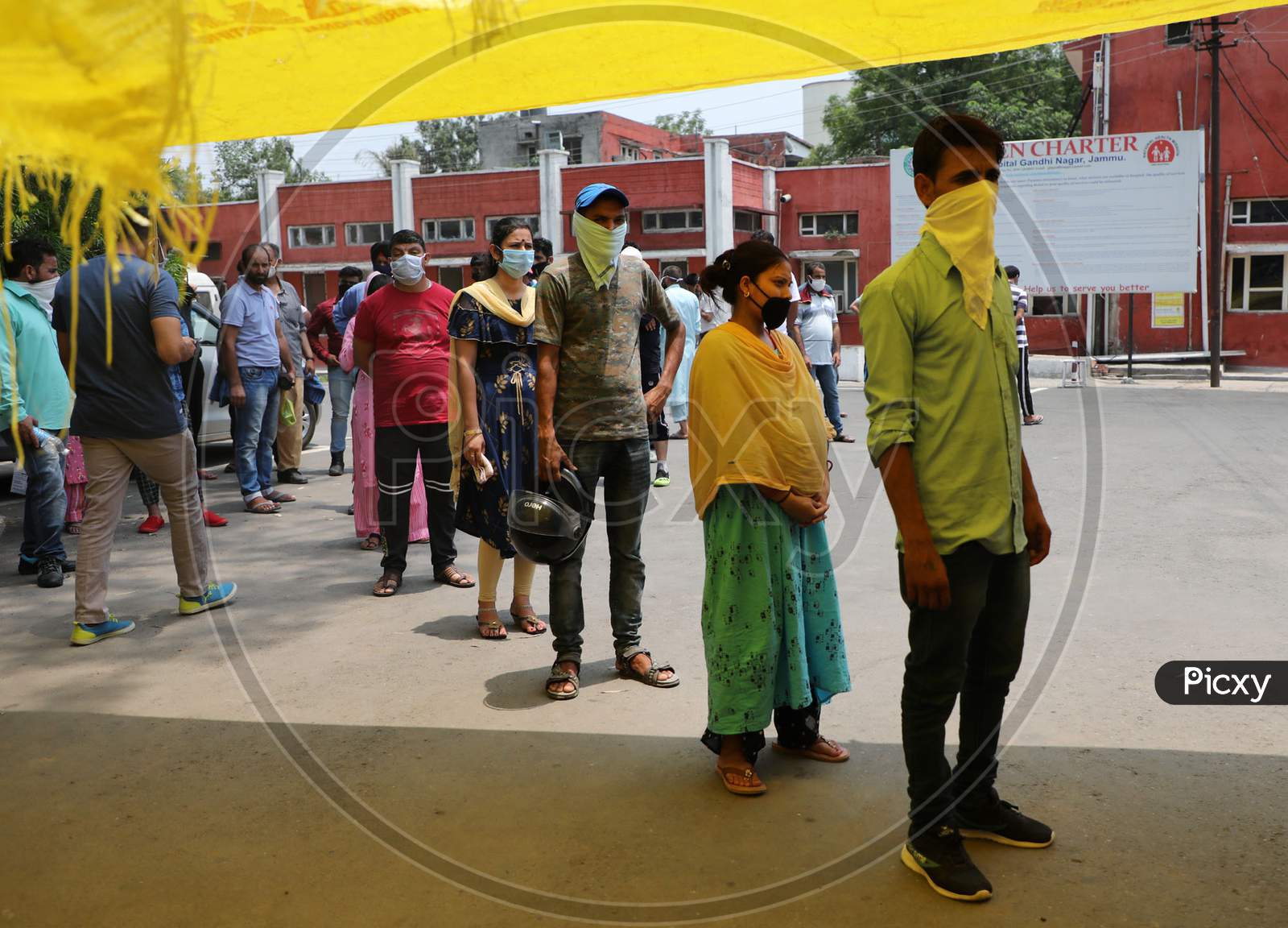 Patients wait in queue for Covid-19 testing at a Government Hospital in Jammu on July 02, 2020.